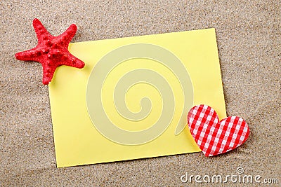 Red starfish lying on the sea sand. Stock Photo