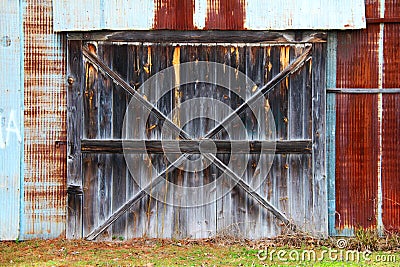 red steel rusty corrugated metal barn warehouse farming storage wooden door farm agriculture architecture background Stock Photo