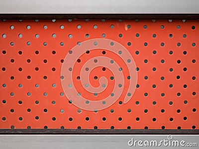 Red steel wall with a lot of hole. Stock Photo