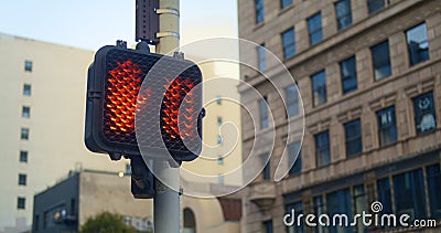 Red stopsignal hand up on crosswalk city close up. Regulation signal on pole Stock Photo