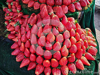 Red strawberries with its green leaves for sale Stock Photo