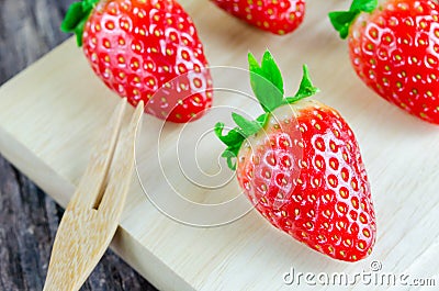 Red Strawberries wooden board Stock Photo