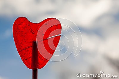 Red strawberry lollipop heart and blue sky Stock Photo