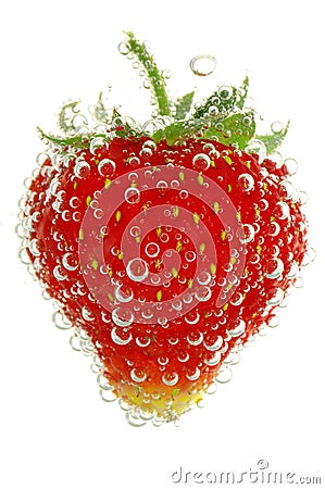 Red strawberry in water with bubbles Stock Photo