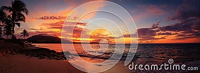 Red sunset panorama on the Caribbean beach with palm trees. Puerto Plata, Dominican Republic, Caribbean Stock Photo