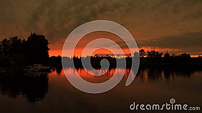 Sunset and red sky over river Stock Photo