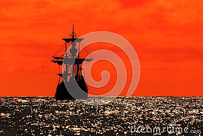 Red sunset silhouette tallship Stock Photo