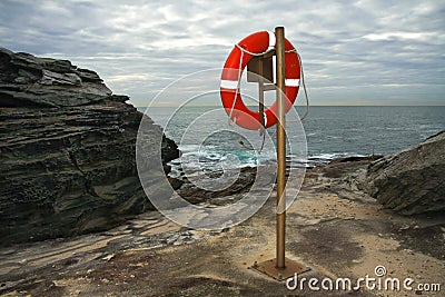 Red surf livesaver ring on post Stock Photo