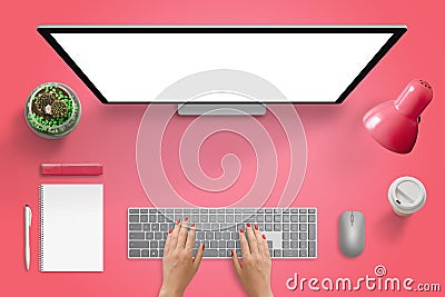 Red surface with computer monitor, keyboard and mouse. Isolated blank screen for mockup Stock Photo