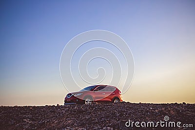 Red SUV near cliff watching sunset Editorial Stock Photo