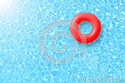 Red swimming pool ring float in blue water and sun bright. Stock Photo