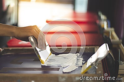 Red T-shirt Screen Printing, Is working finely Stock Photo