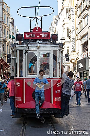 Red Taksim Tunel Nostalgic Tram on the istiklal street. Istanbul, Turkey Editorial Stock Photo