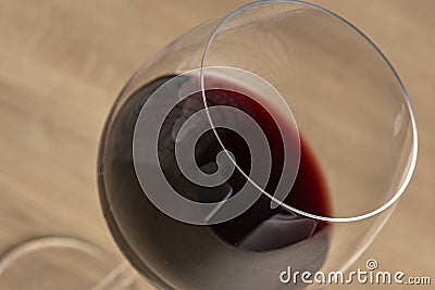 Red tasty wine on a wineglass on a diagonal position Stock Photo