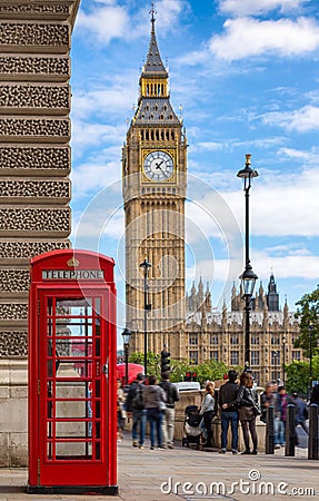 Red telephone booth in front of the Big Ben in London, United Kingdom Editorial Stock Photo