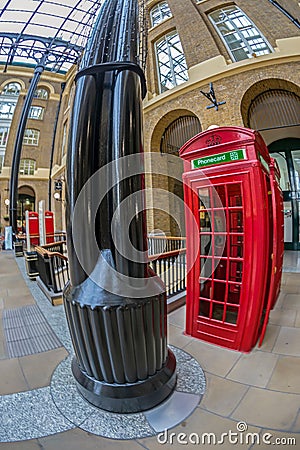 Red telephone booth in Hays Galleria, London Editorial Stock Photo