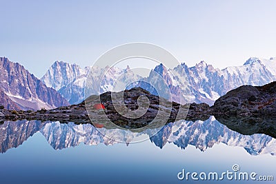 Red tent on Lac Blanc lake Stock Photo