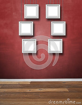 Red textured wall and Alu frames hanging Stock Photo