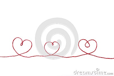 Red thread and three hearts isolated on white Stock Photo