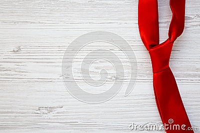 Red tie on white wooden background. Happy Father`s Day. Copy spa Stock Photo