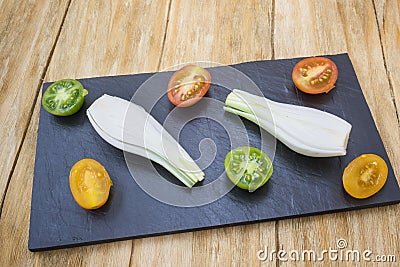 Red tomatoes, yellow and scallions Stock Photo