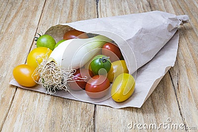Red tomatoes, yellows, greens and scallions Stock Photo