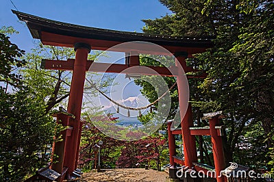 Red tori with Mount Fuji in the background at Chureito pagoda Stock Photo