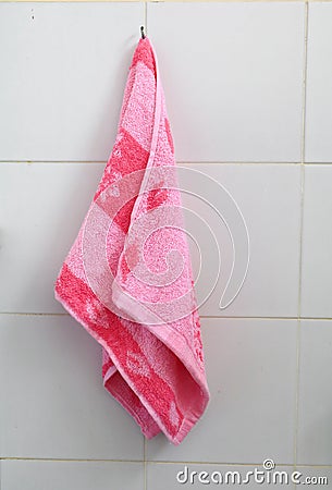 Red towel for wipe hand in toliet room on wall Stock Photo