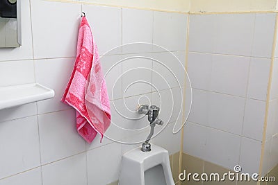 Red towel for wipe hand in toliet room on wall Stock Photo