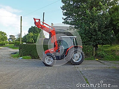 Red tractor on a farm in Ireland Stock Photo