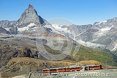 Train, Swiss Alps and the top of the Matterhorn Stock Photo