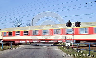 Red train crossing. Stock Photo