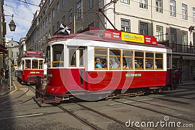 Some red trams to the narrow streets of Lisbon Editorial Stock Photo