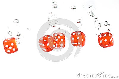 Red transparent dice falling into the water Stock Photo