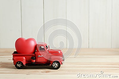 Red Truck and heart, ready to delivery love on Valentine`s day Stock Photo