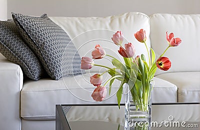 Red tulips in modern living room - home decor Stock Photo