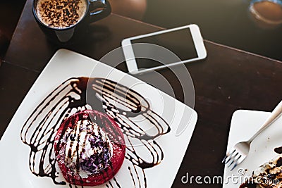 Red velvet cake table top view of Dessert at meeting in cafe, business lunch concept meet at the Cafe for a coffee and talk to Stock Photo