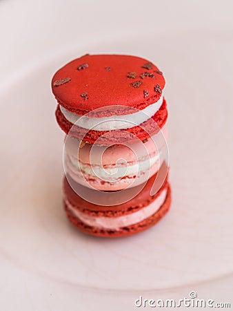 Red velvet, rose and raspberry macarons Stock Photo