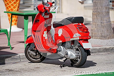 Red Vespa motor scooter photo Editorial Stock Photo