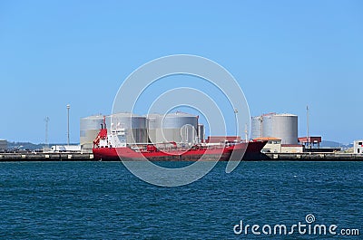 Red vessel and tanks Stock Photo