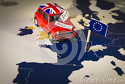 Red vintage car with Union Jack flag and brexit or bye words over an UE map and flag. Stock Photo