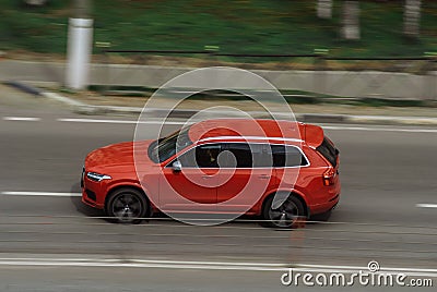 Red Volvo XC90 second generation on the city road. Fast moving car on Moscow streets. Vehicle driving along the street in city Editorial Stock Photo