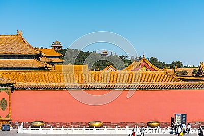 Red wall and golden tiles rooftops of The Forbidden City,the former Chinese imperial palace from the Ming dynasty to the end of Editorial Stock Photo