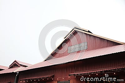 Red wall and roof of warehouse background Stock Photo