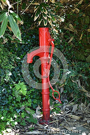 Red water pump Mylor Cornwall UK Stock Photo
