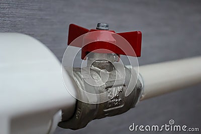 Red water valve on pipeline Stock Photo