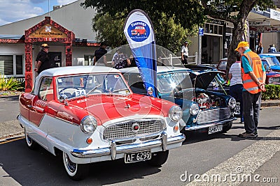 Classic small cars on display at an outdoor car show Editorial Stock Photo