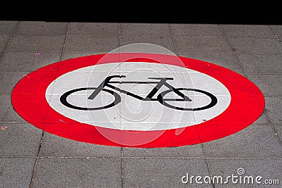 Bicycle symbol on gray asphalt Stock Photo