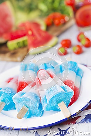 Red-white-and-blue popsicles on an outdoor table Stock Photo