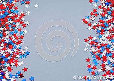 Red white blue shiny confetti stars on grey background, tricolor concept, independence and freedom day USA Stock Photo